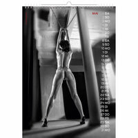 Calendar with a black and white image of a person hanging from chains, with dates on the right side.