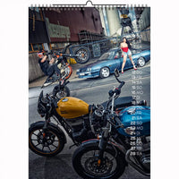 Urban motorcycle stunt scene with two Royal Enfield bikes and a model in red – from 2026 calendar series