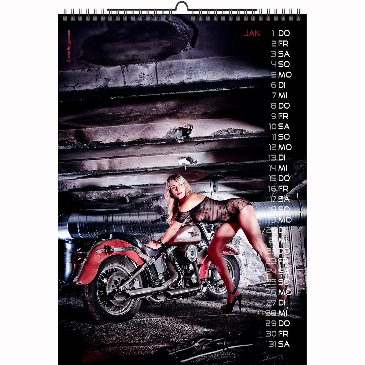 Bikini model with bunny ears posing in front of a sportbike and colorful backdrop – motorcycle calendar 2026 edition