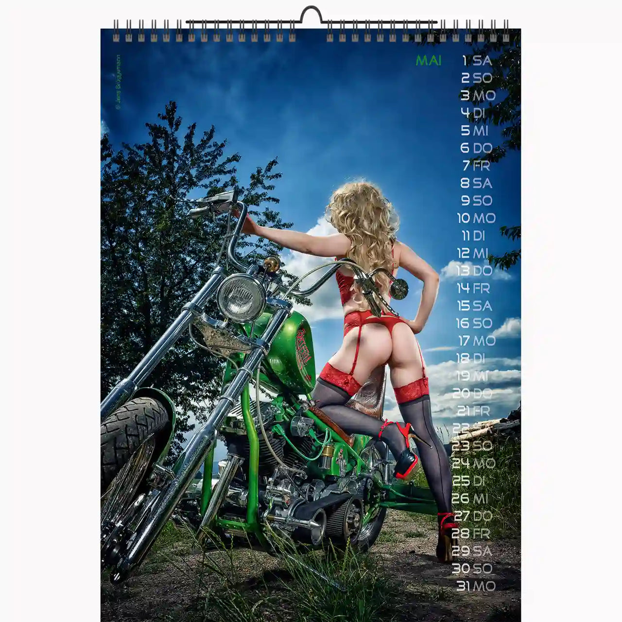 woman in red lingerie leaning on a green bike on the countryside