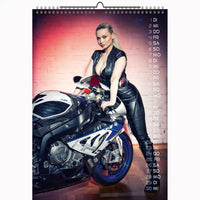 Calendar with a woman in leather outfit leaning on a motorcycle against a brick wall.