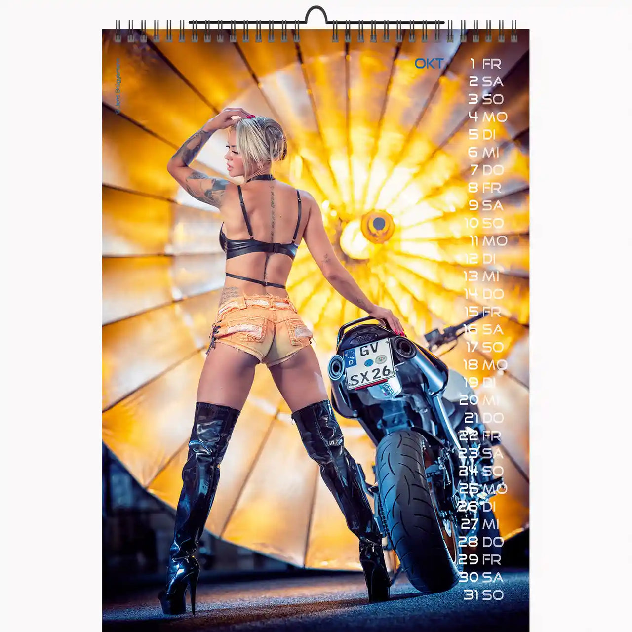 Calendar with a woman on a motorcycle against a bright background