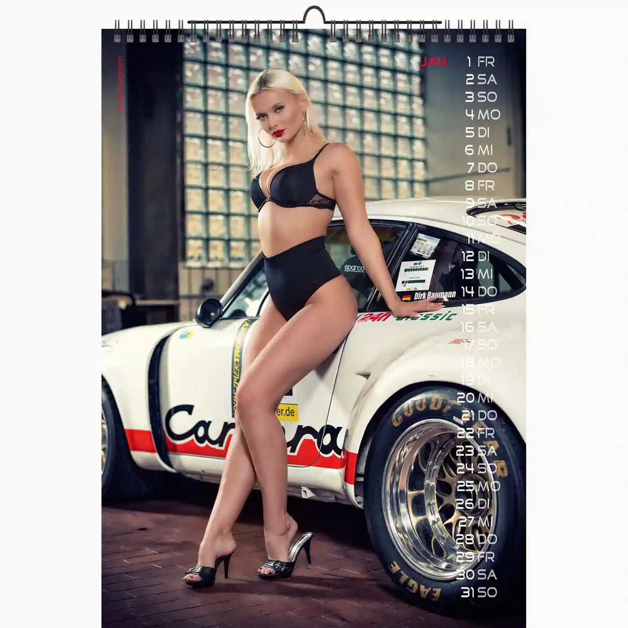 Calendar with a model in a black outfit leaning against a white race car.