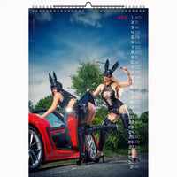 Calendar with two women in bunny costumes standing next to a red car on a scenic background.