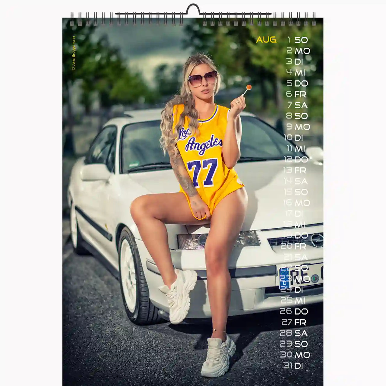 calendar with a woman wearing a yellow basketbal shirt sitting on a white opel car