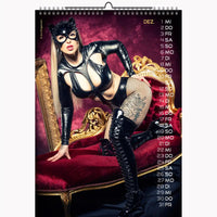 Calendar with a person in a black leather outfit on a red couch