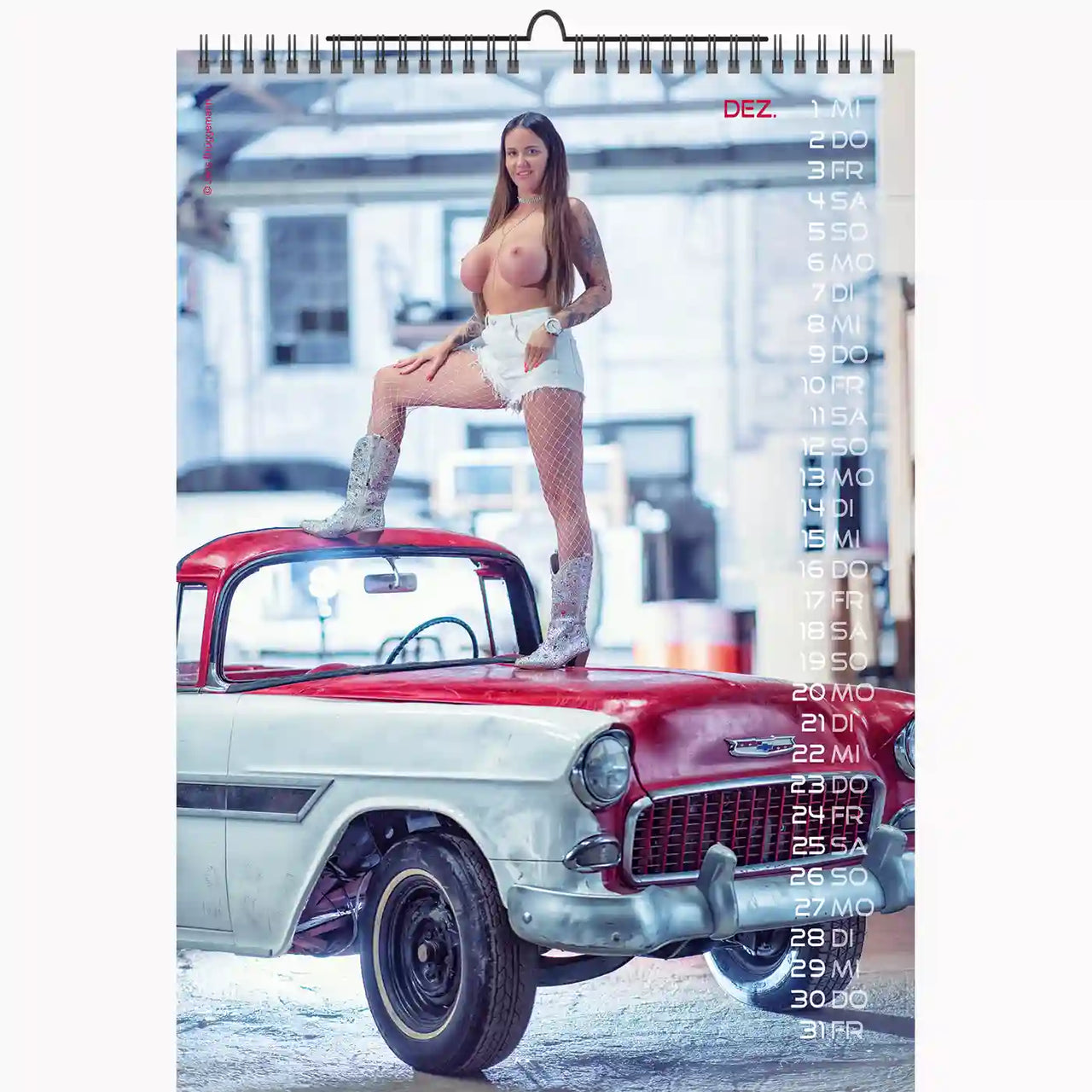Calendar with a woman standing on a classic car in an industrial setting