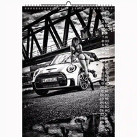 Calendar with a black and white photo of a car and a person sitting on it, with a bridge in the background.