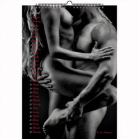 Passionate embrace of two women on a wooden floor in bondage-inspired lingerie, exuding intensity and erotic power