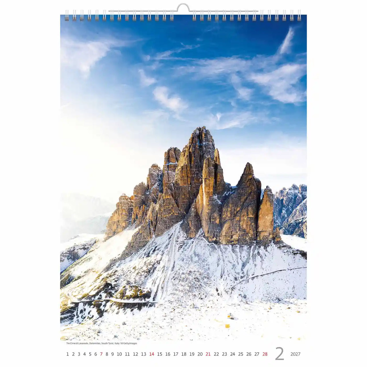 Kalender met een foto van een besneeuwde berg onder een blauwe lucht
