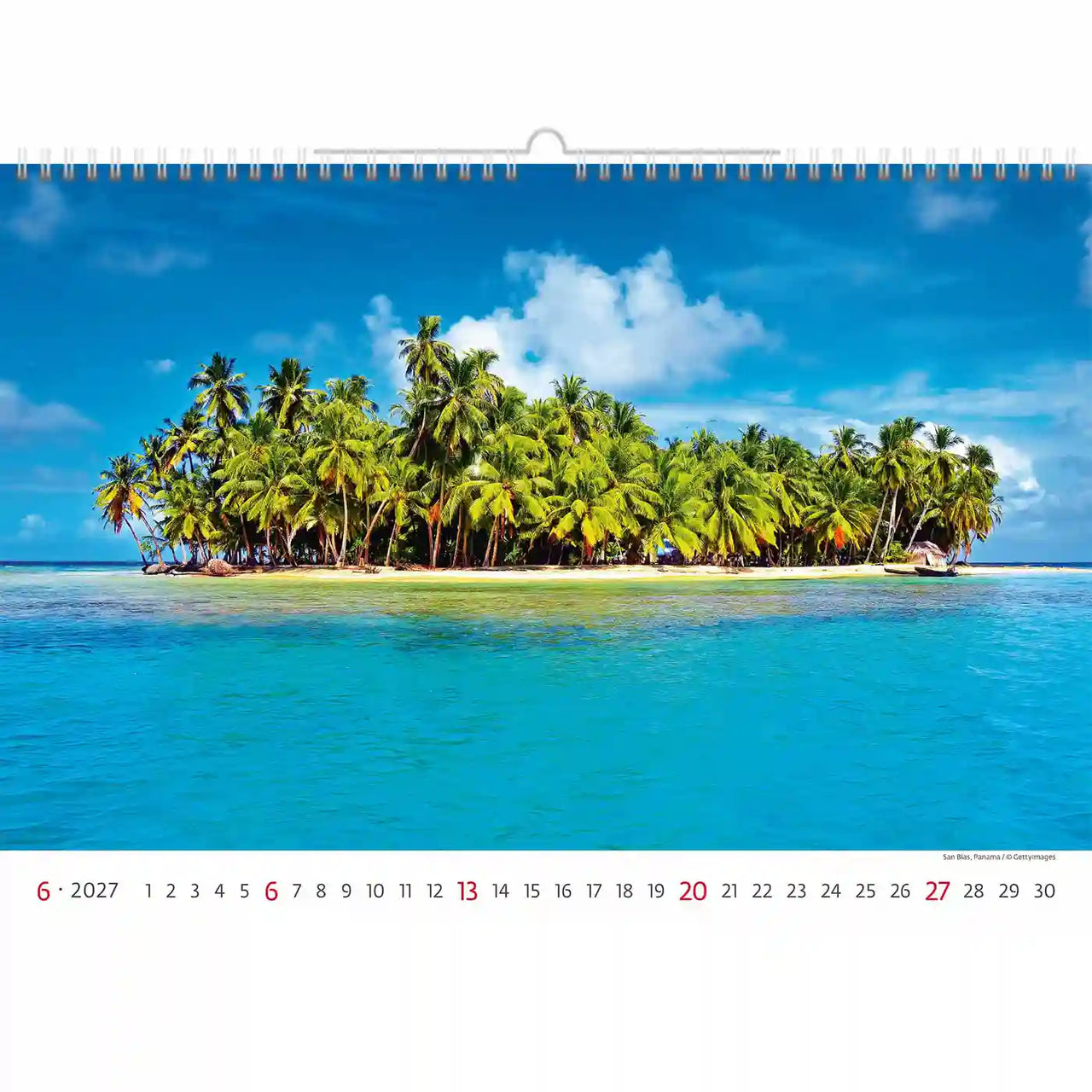 Kalender met een tropisch eilandtafereel met palmbomen en helderblauw water.
