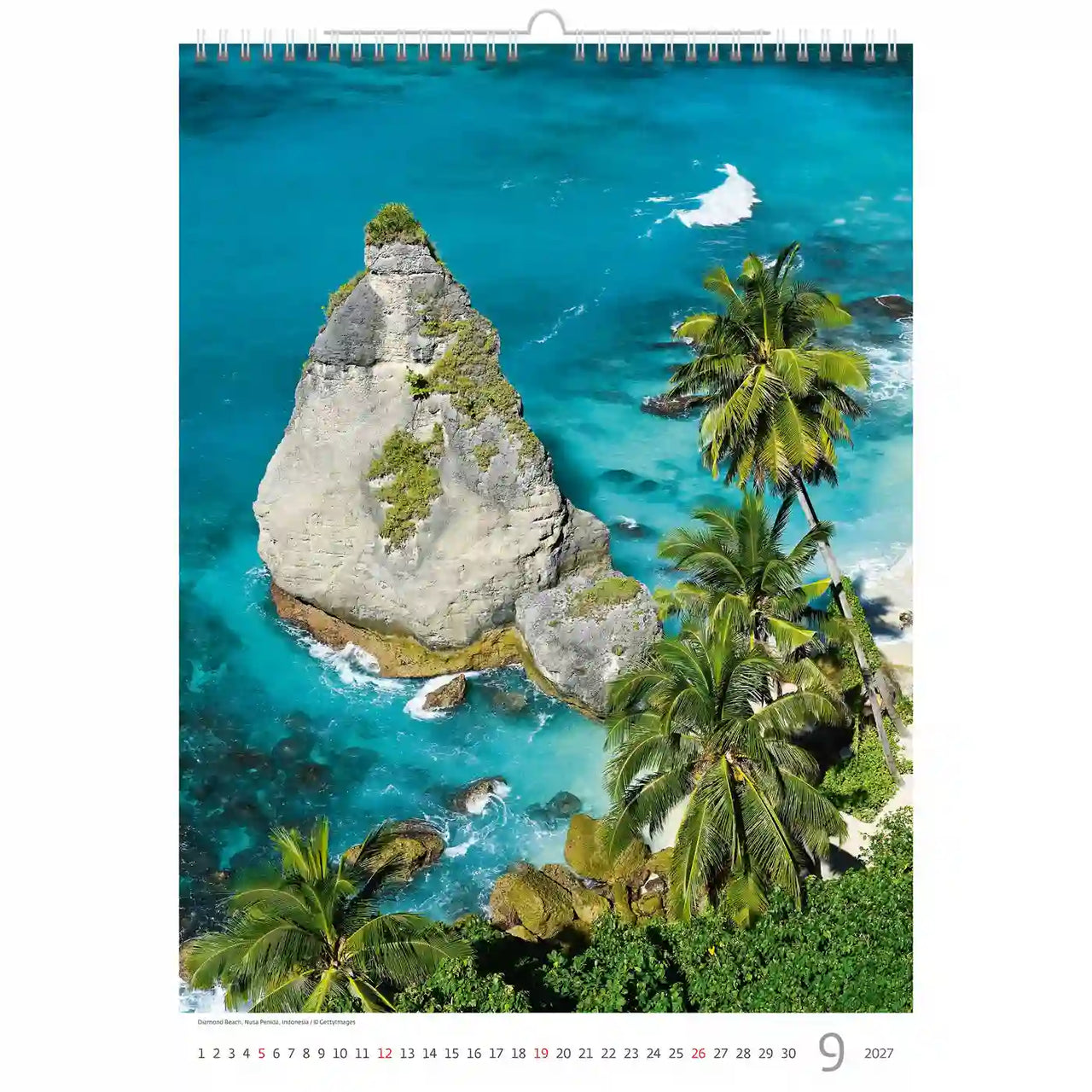 Kalender met een luchtfoto van een tropisch eiland met palmbomen en turquoise zee.