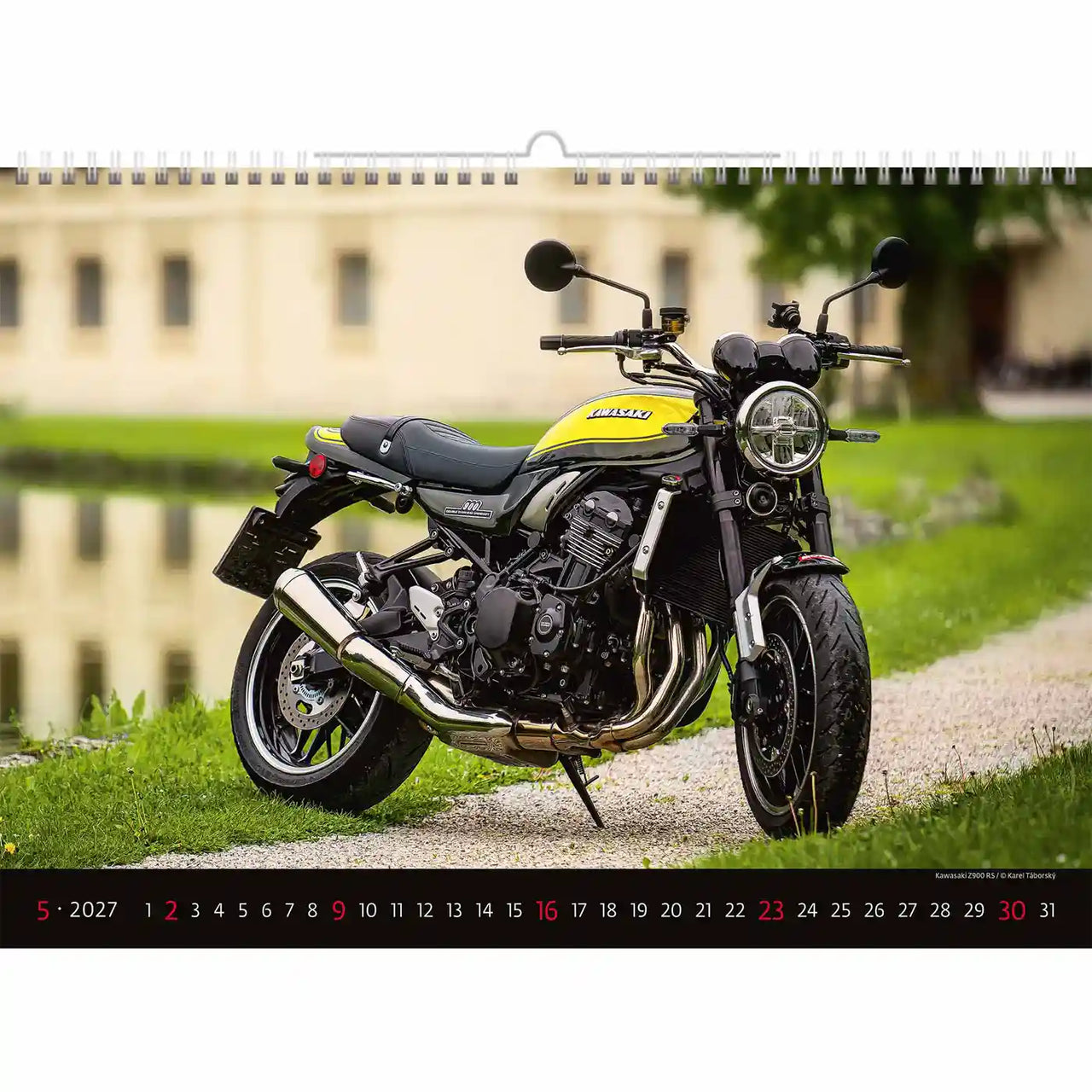 Motorfiets op een kalender met een schilderachtige achtergrond