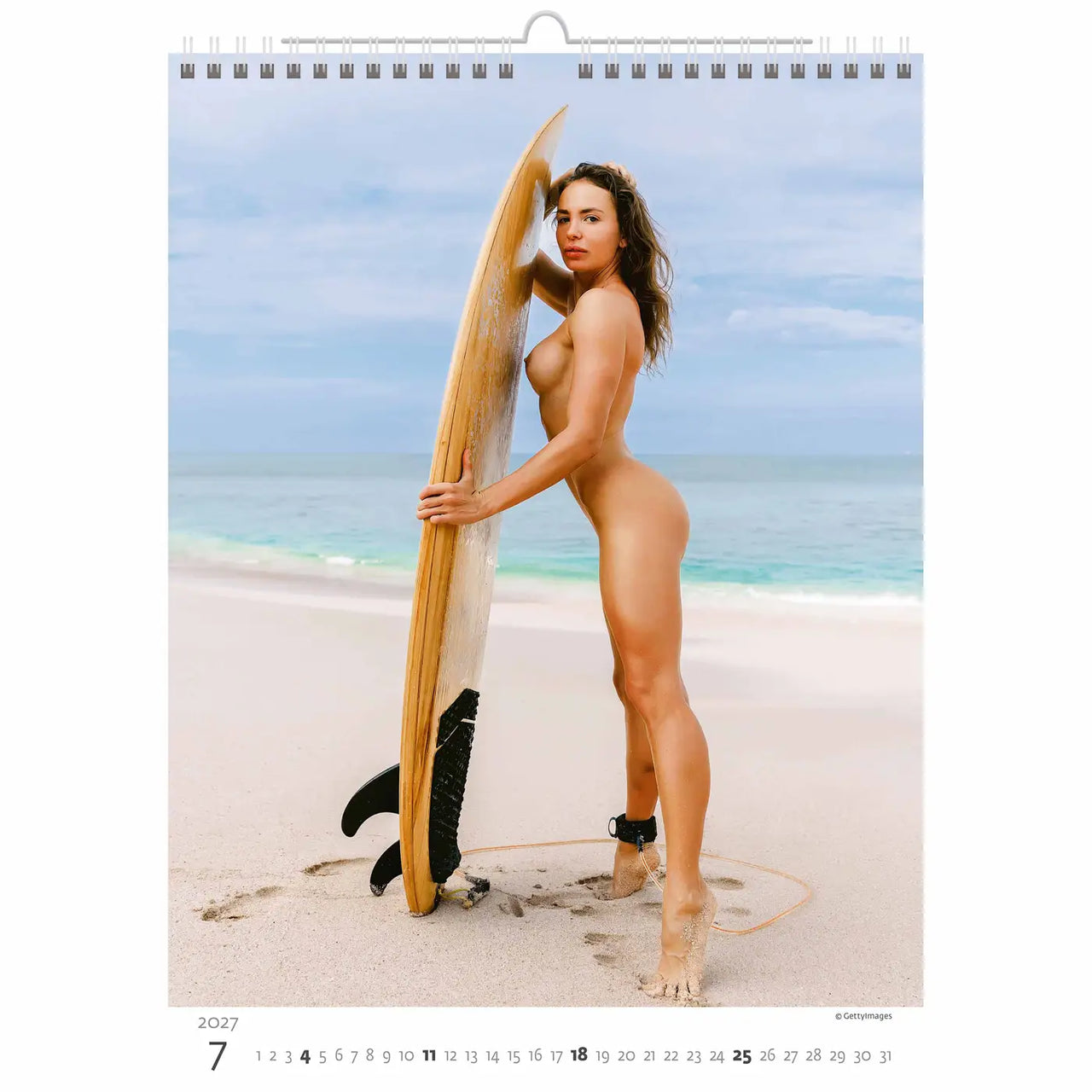 Calendar page showing a woman holding a surfboard on a beach