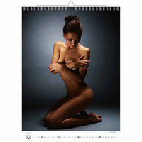 Naked woman kneeling on a dark background with a calendar layout