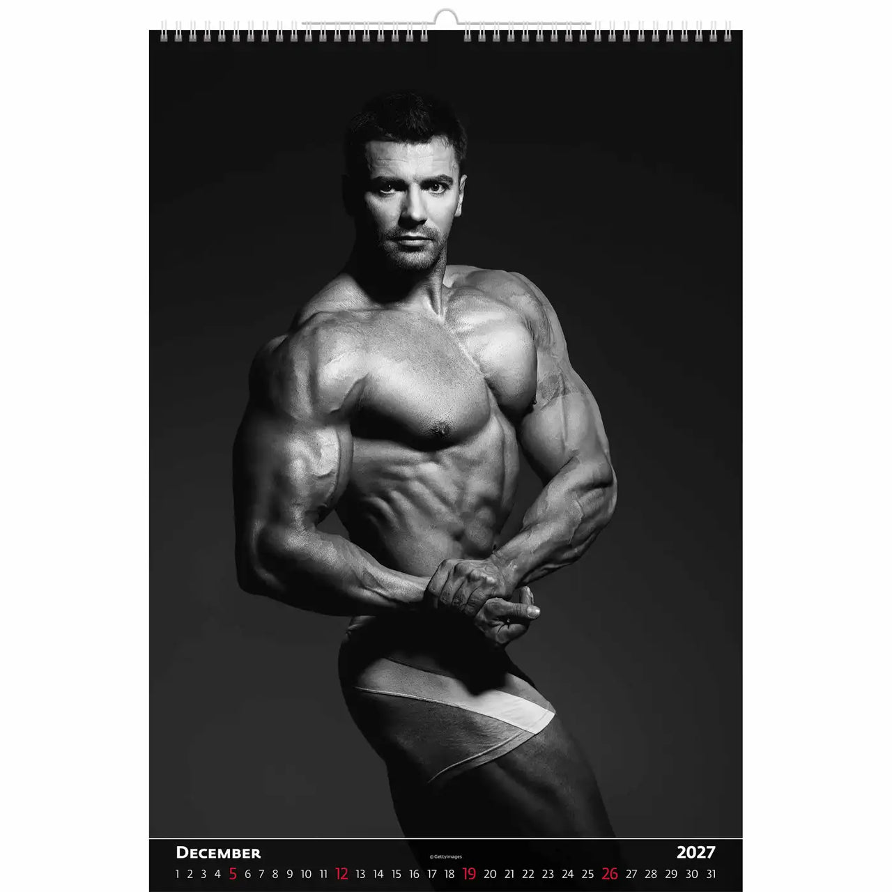 Kalenderpagina voor december 2027 met een zwart-witfoto van een gespierde man.