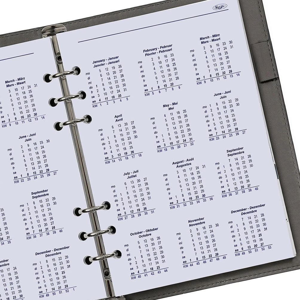 Calendar page with months listed in a ring-bound planner