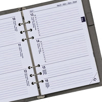 Close-up of a planner with a ring binding system on a white background