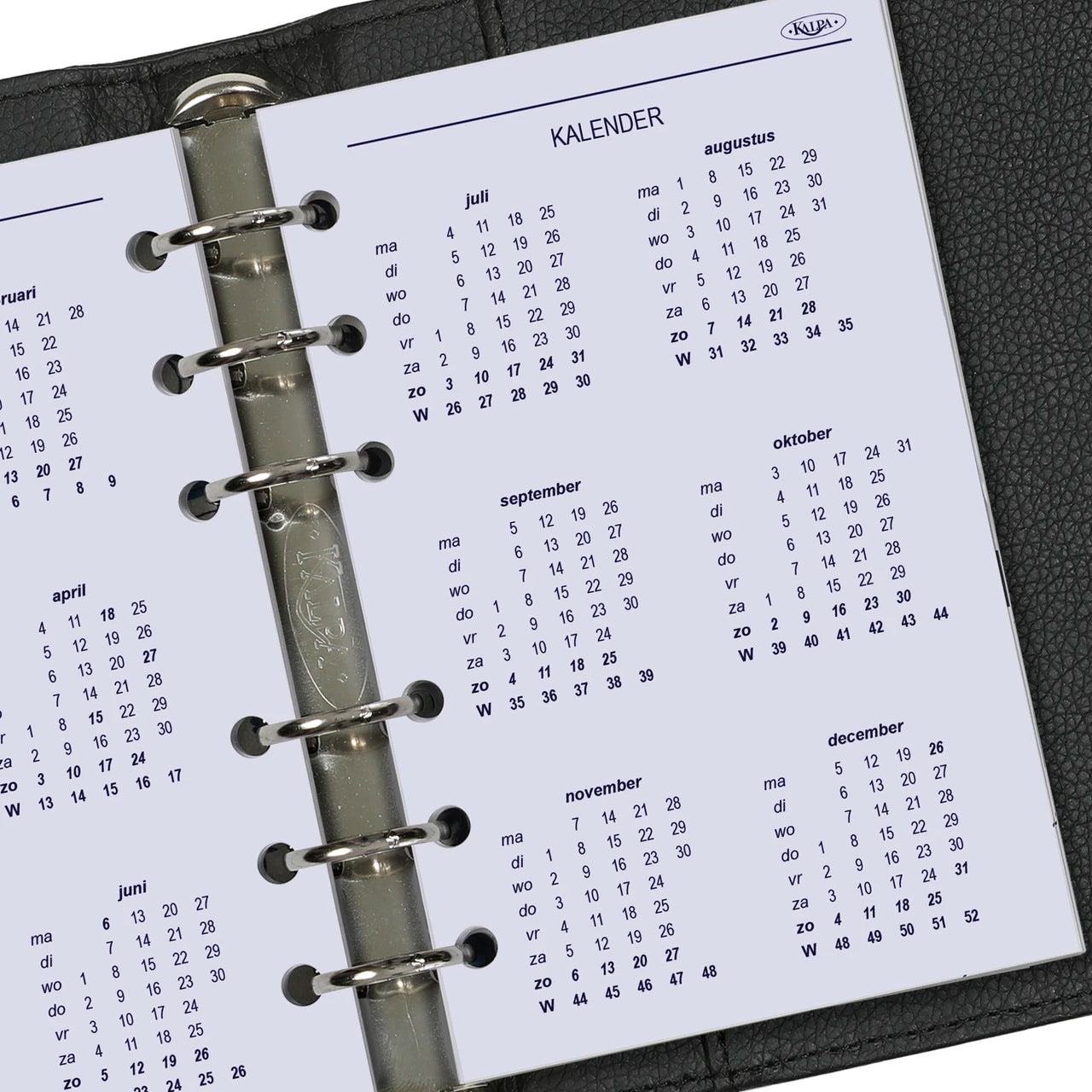 Calendar page in a ring-bound planner with visible brand name.