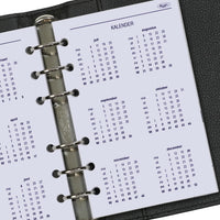 Calendar page in a ring-bound planner with visible brand name.