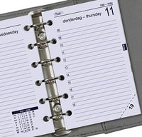 Close-up of a Kulesv planner with a metal ring binding on a gray background