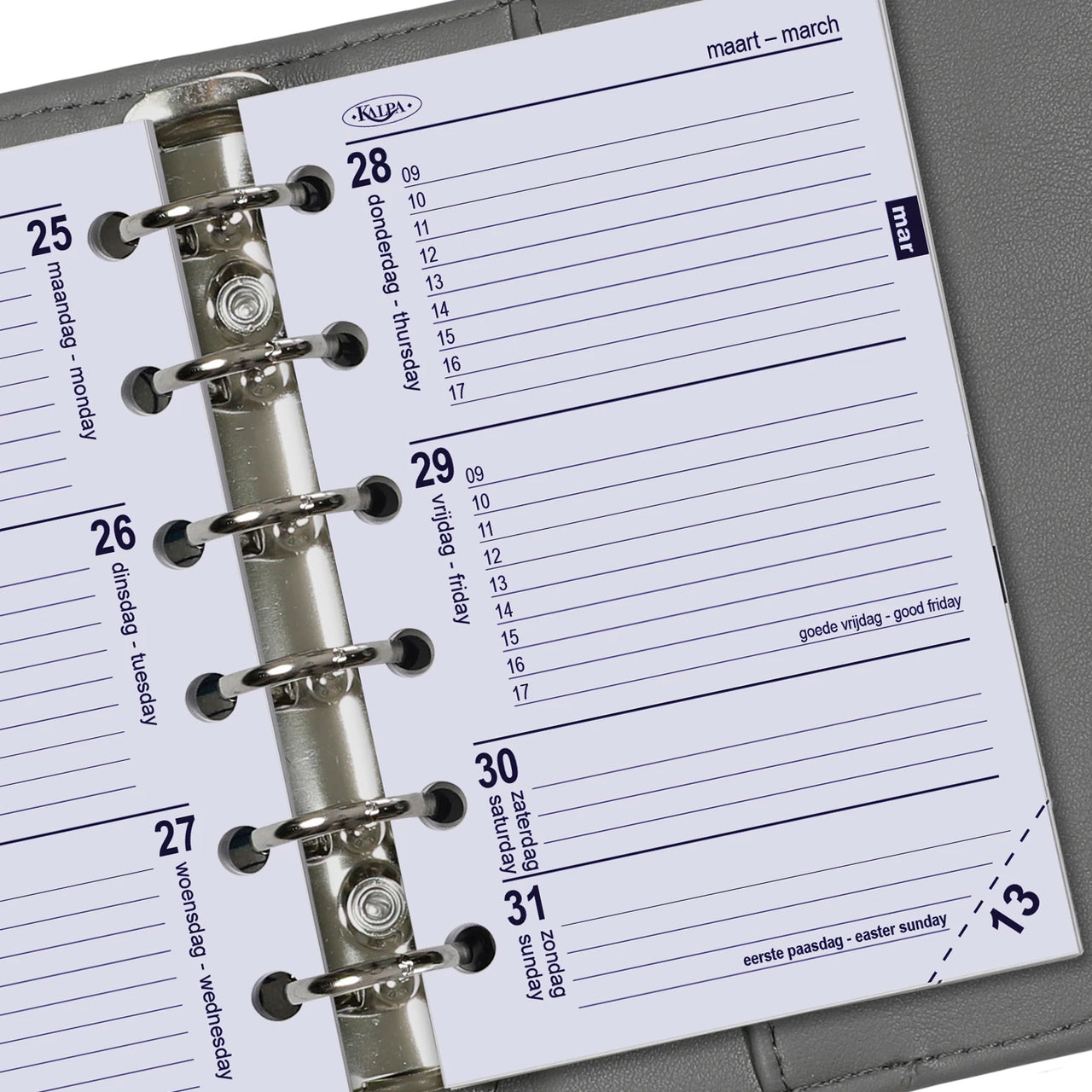 Close-up van een planner met een metalen ringbindsysteem op een grijze achtergrond