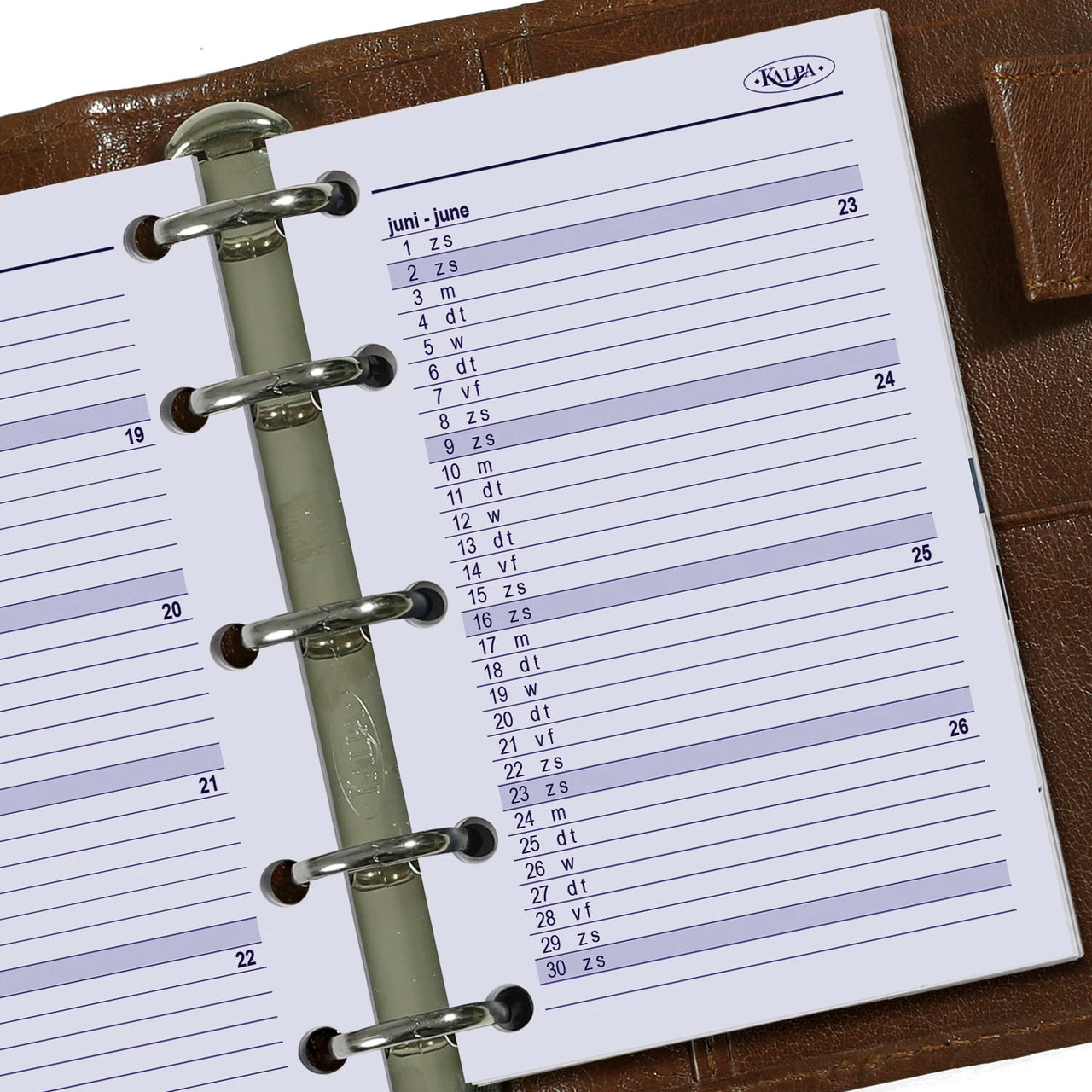 Close-up of a planner with a monthly calendar on a wooden surface