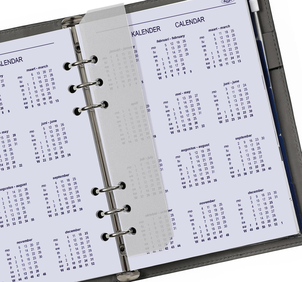 Calendar pages in a ring-bound planner with visible text and dates.