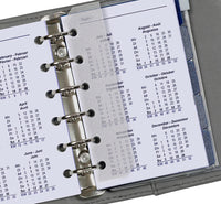 Close-up of a planner with a calendar page showing months.