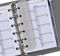 Close-up van een planner met een maandkalender indeling.