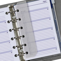 Close-up of a Kipu planner with a metal ring binding